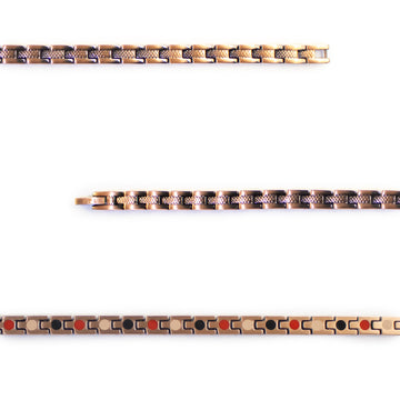 Close-up of Ember copper bracelet showing textured etched bar and polished edges.